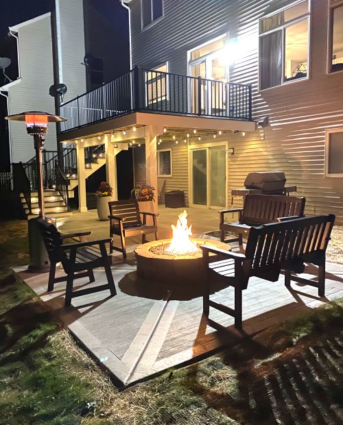 backyard oasis with fire pit and upper deck